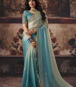 Cream & sky blue faux satin shimmer saree with embroidered blouse