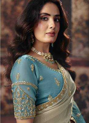 Cream & sky blue faux satin shimmer saree with embroidered blouse 2