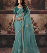 Sea green shimmer faux organza saree with embroidered blouse