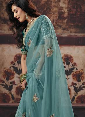 Sea green shimmer faux organza saree with embroidered blouse 2