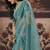Sea green shimmer faux organza saree with embroidered blouse