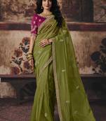 Olive green shimmer faux organza saree with rani pink embroidered blouse