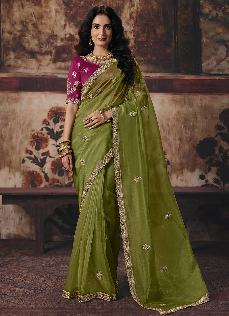 Olive green shimmer faux organza saree with rani pink embroidered blouse