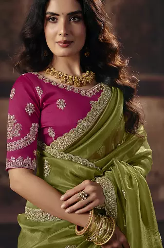 Olive green shimmer faux organza saree with rani pink embroidered blouse