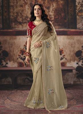 Beige gold shimmer saree faux organza saree with red embroidered blouse 1