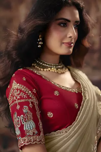 Beige gold shimmer saree faux organza saree with red embroidered blouse