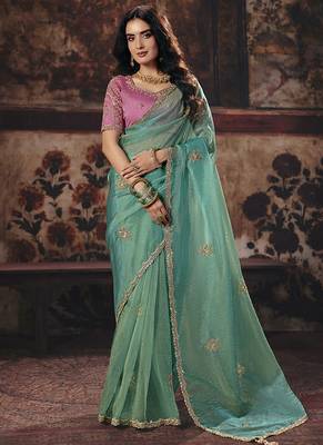 Sea green shimmer faux organza saree with pink embroidered blouse 1