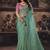 Sea green shimmer faux organza saree with pink embroidered blouse