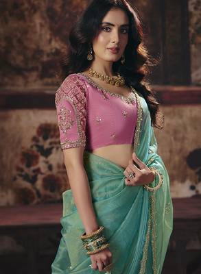 Sea green shimmer faux organza saree with pink embroidered blouse 2