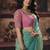 Sea green shimmer faux organza saree with pink embroidered blouse