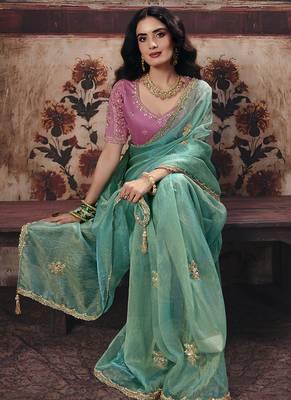 Sea green shimmer faux organza saree with pink embroidered blouse 3