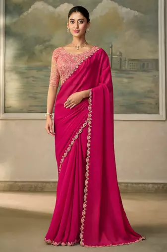 Rani pink faux georgette embroidered saree with blouse piece