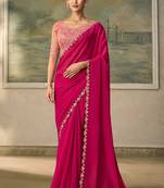 Rani pink faux georgette embroidered saree with blouse piece