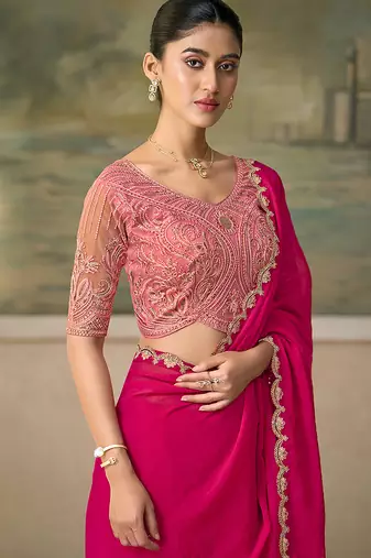 Rani pink faux georgette embroidered saree with blouse piece