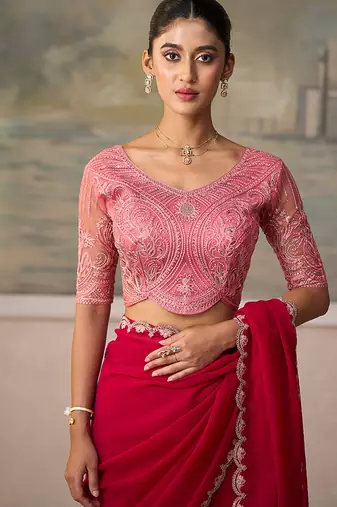 Rani pink faux georgette embroidered saree with blouse piece
