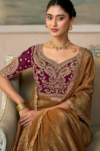 Brown faux georgette embroidered saree with wine blouse