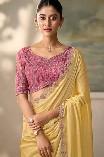 Light yellow faux chiffon saree with embroidered tussar blouse