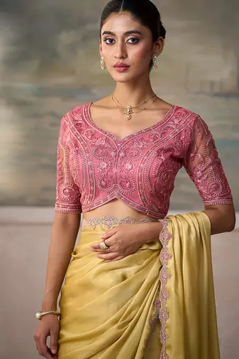 Light yellow faux chiffon saree with embroidered tussar blouse