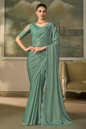 Sea green faux chiffon saree with embroidered blouse