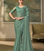 Sea green faux chiffon saree with embroidered blouse