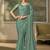 Sea green faux chiffon saree with embroidered blouse