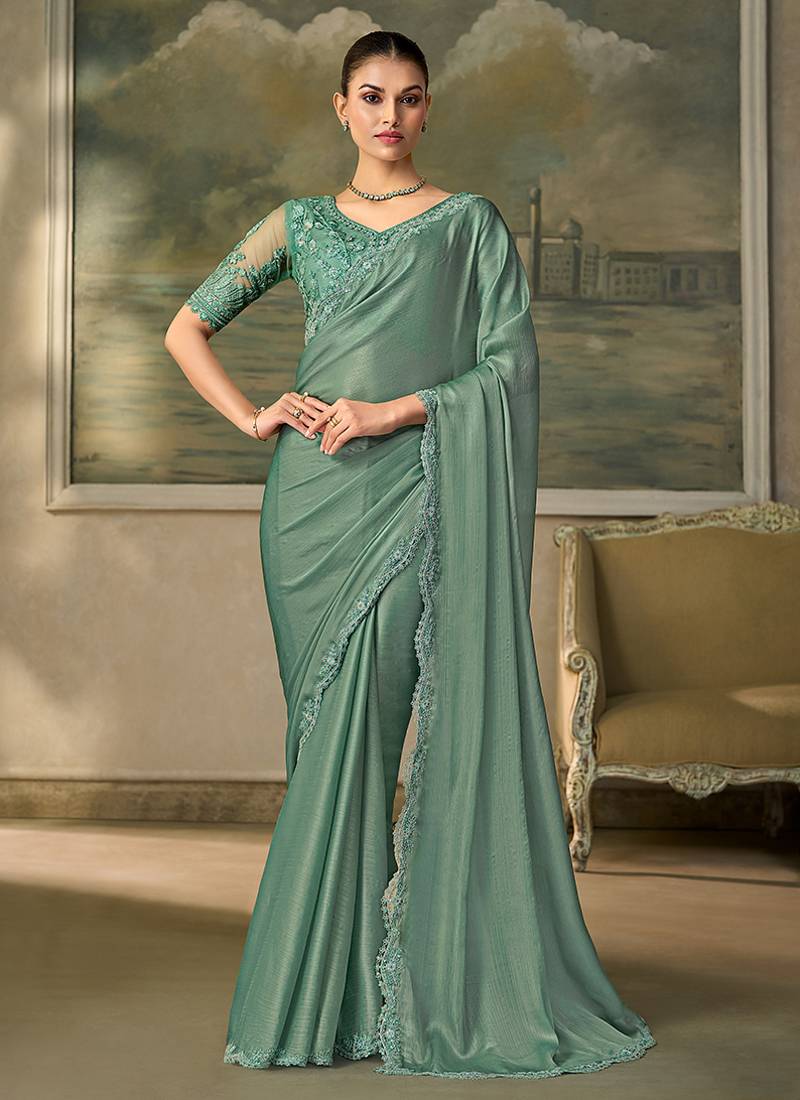 Sea green faux chiffon saree with embroidered blouse