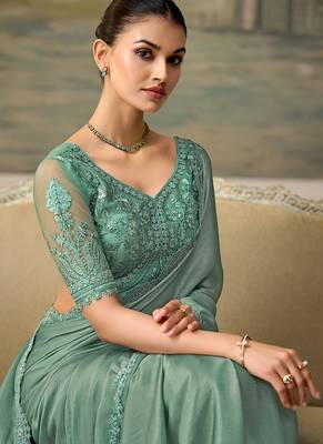 Sea green faux chiffon saree with embroidered blouse 2
