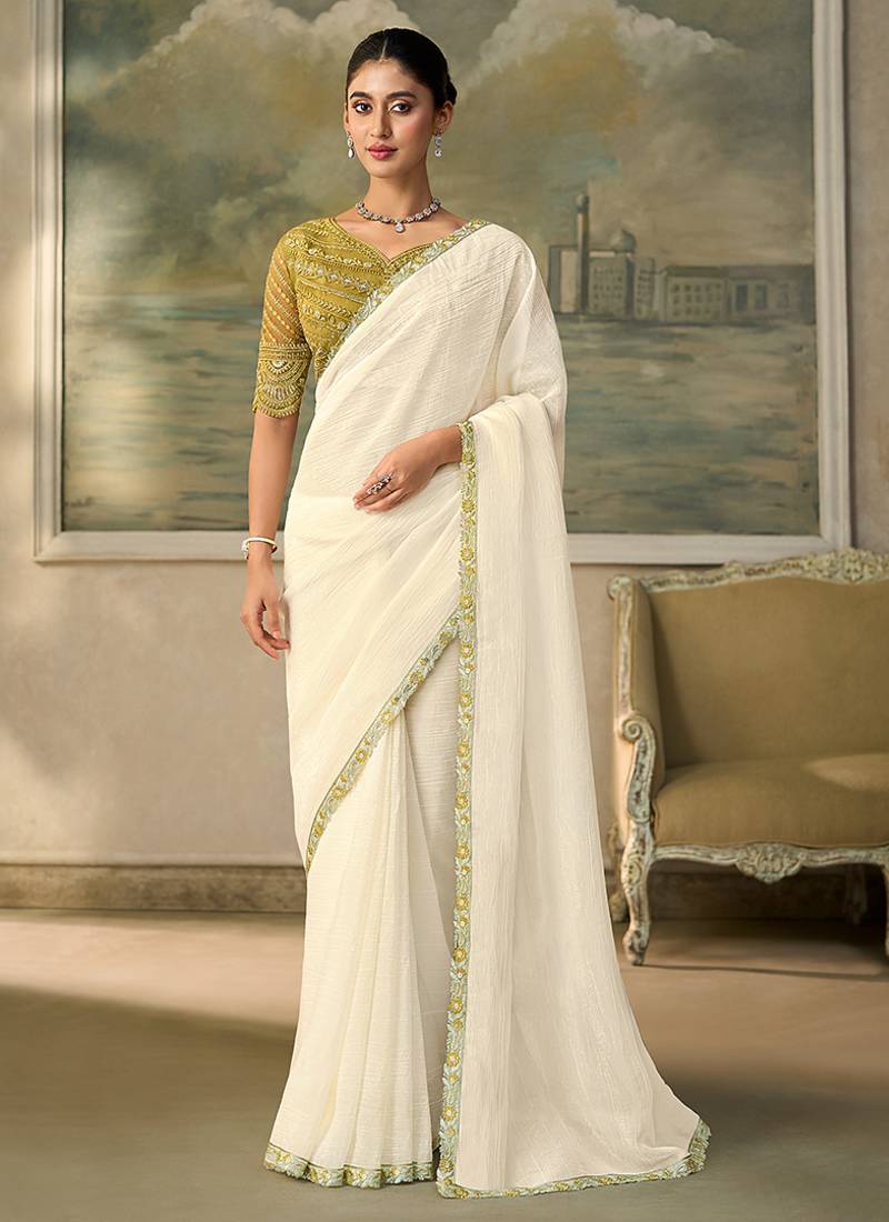 Off-white faux georgette saree with embroidered olive tussar blouse