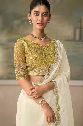 Off-white faux georgette saree with embroidered olive tussar blouse