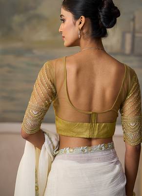 Off-white faux georgette saree with embroidered olive tussar blouse 4