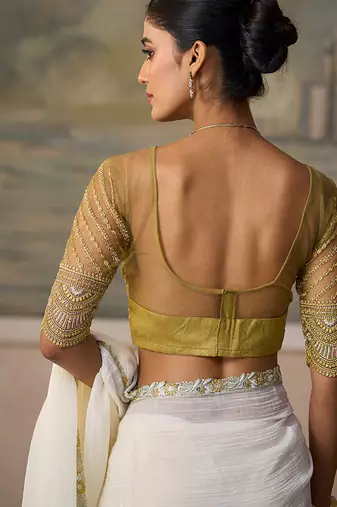 Off-white faux georgette saree with embroidered olive tussar blouse