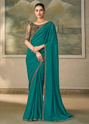 Teal faux georgette saree with embroidered antique gold blouse 1