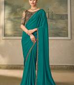 Teal faux georgette saree with embroidered antique gold blouse