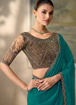 Teal faux georgette saree with embroidered antique gold blouse 2