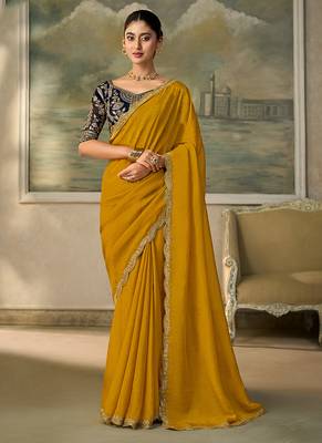 Mustard yellow faux georgette saree with embroidered navy blue blouse 1
