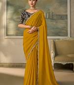 Mustard yellow faux georgette saree with embroidered navy blue blouse