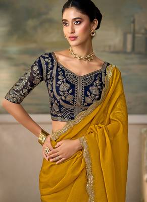 Mustard yellow faux georgette saree with embroidered navy blue blouse 2