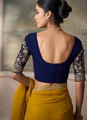Mustard yellow faux georgette saree with embroidered navy blue blouse 4
