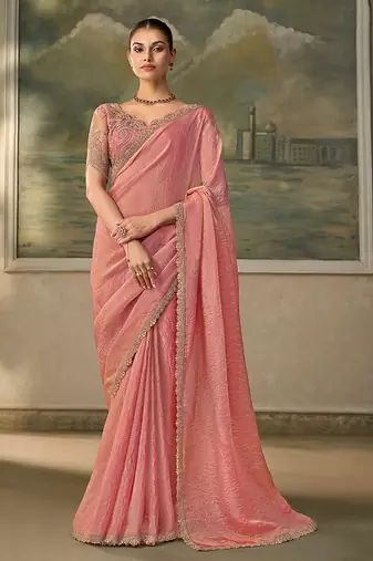 Peach pink faux tissue saree with embroidered blouse