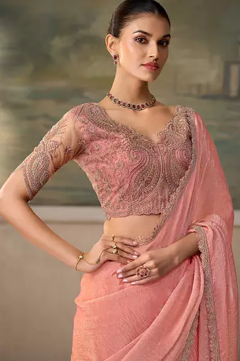 Peach pink faux tissue saree with embroidered blouse
