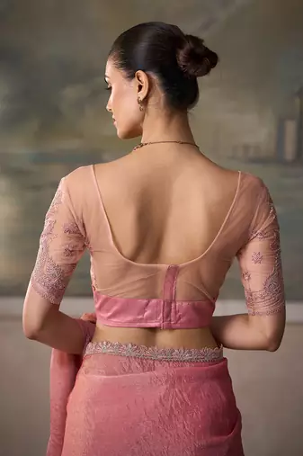 Peach pink faux tissue saree with embroidered blouse
