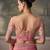 Peach pink faux tissue saree with embroidered blouse