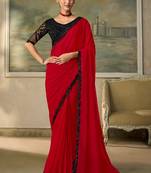 Red faux chiffon saree with black embroidered border and  blouse
