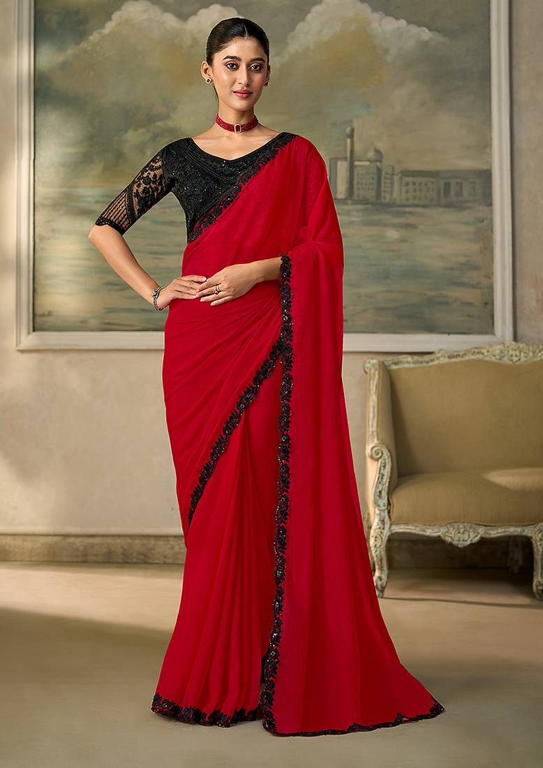 Red faux chiffon saree with black embroidered border and  blouse
