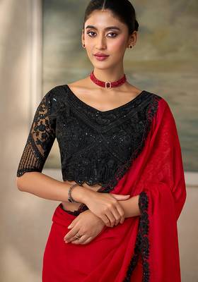 Red faux chiffon saree with black embroidered border and  blouse 2