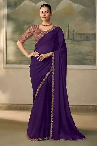 Dark purple faux  georgette saree with embroidered border & rose-gold blouse