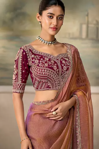Rose gold metallic faux georgette saree with embroidered wine blouse