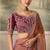 Rose gold metallic faux georgette saree with embroidered wine blouse