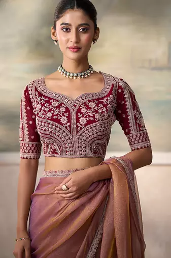 Rose gold metallic faux georgette saree with embroidered wine blouse