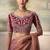 Rose gold metallic faux georgette saree with embroidered wine blouse